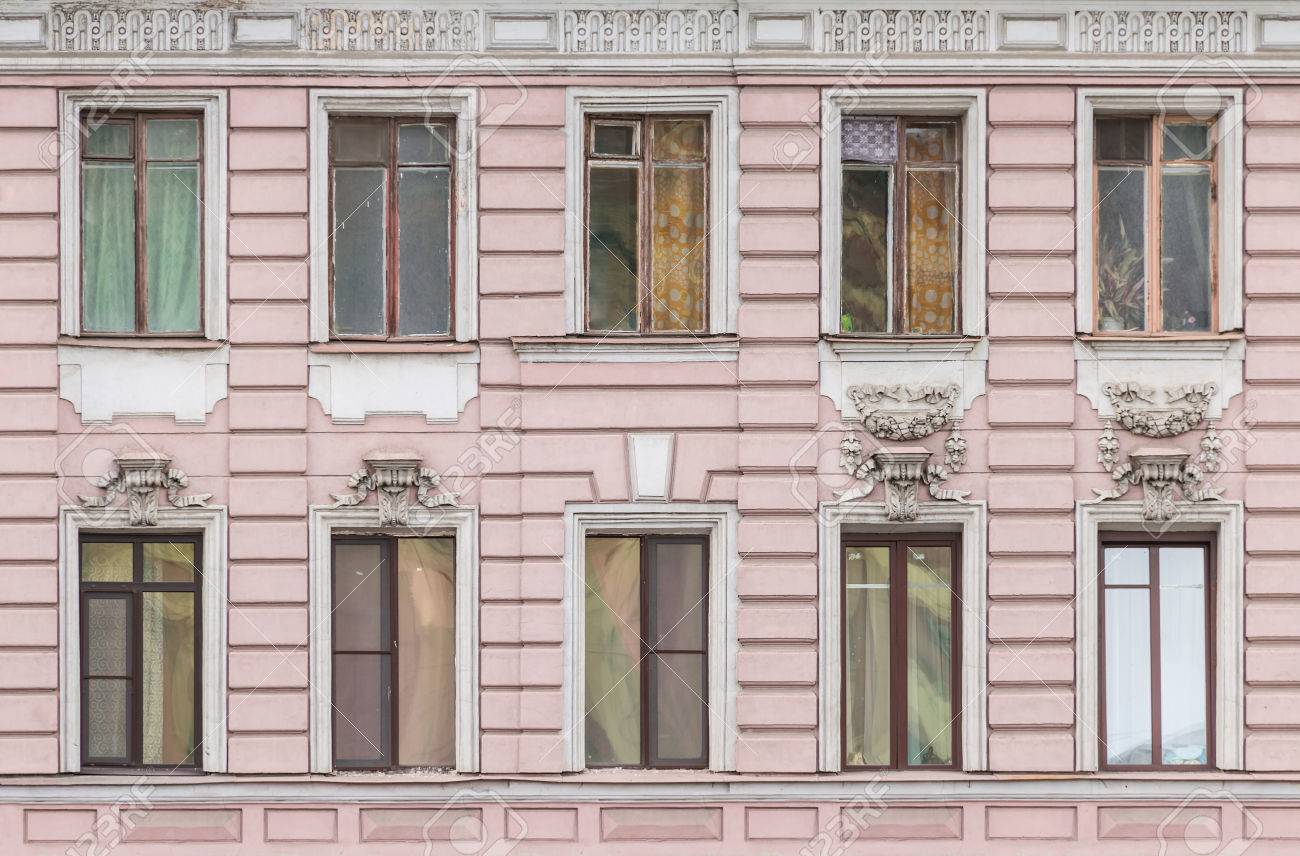 Apartment Building Front several windows in a row on facade of urban apartment building Apartment Building Front several windows in a row on facade of urban apartment building