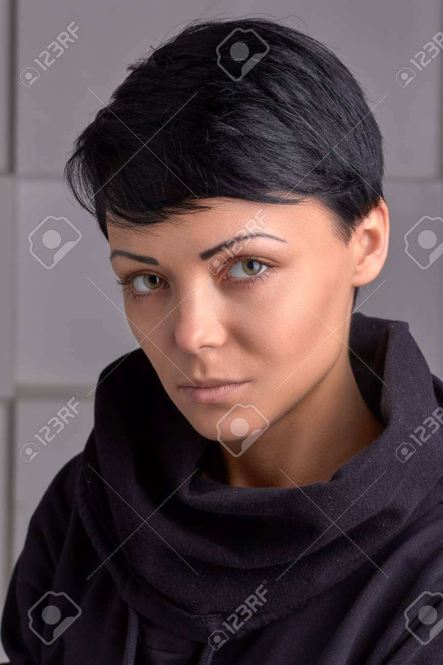 Close Portrait Of Young Girl Black Wear With High Collar Grey