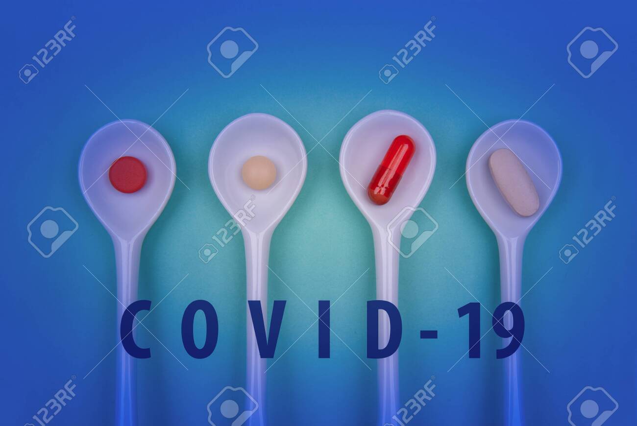 Pills in spoons against the virus Coronavirus or COVID-19 concept in spoon. Medical concept of Virus Pandemic Protection, Coronavirus COVID-19 - 144475491 Pills in spoons against the virus Coronavirus or COVID-19 concept in spoon. Medical concept of Virus Pandemic Protection, Coronavirus COVID-19 - 144475491