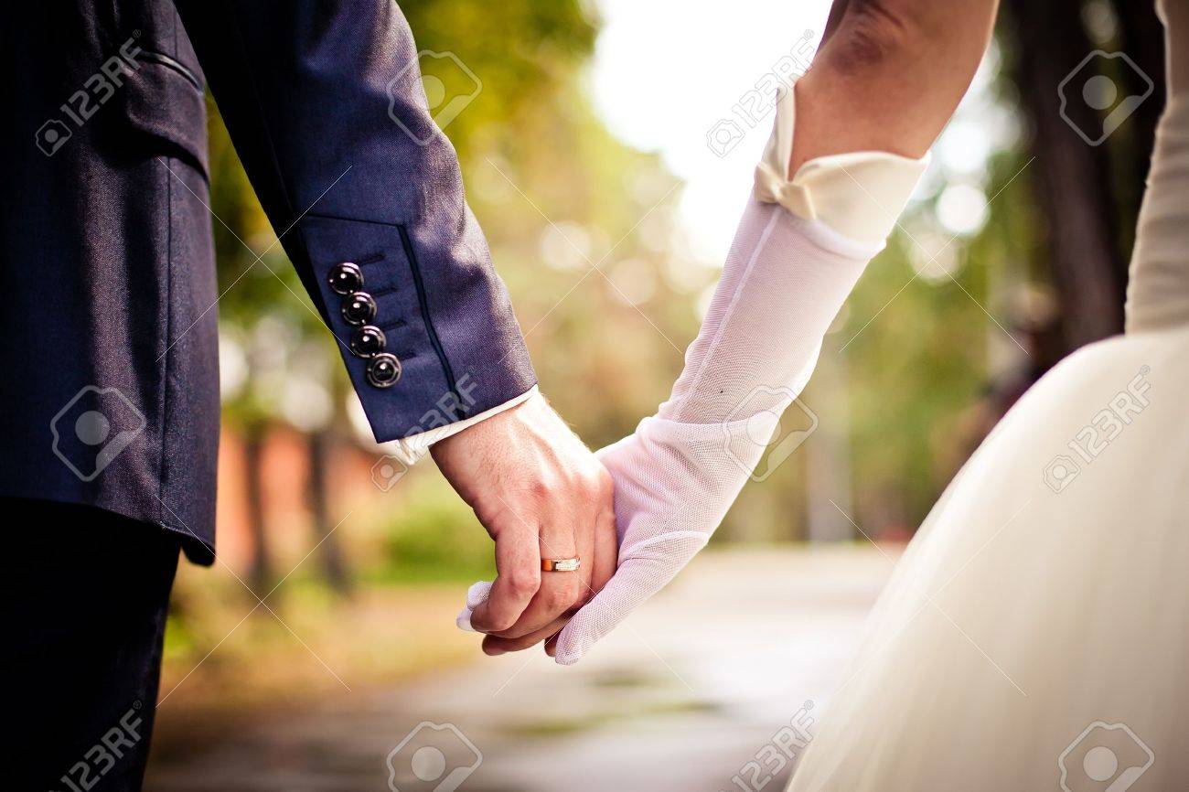 Bride And Groom Holding Hands Stock Photo Picture And Royalty