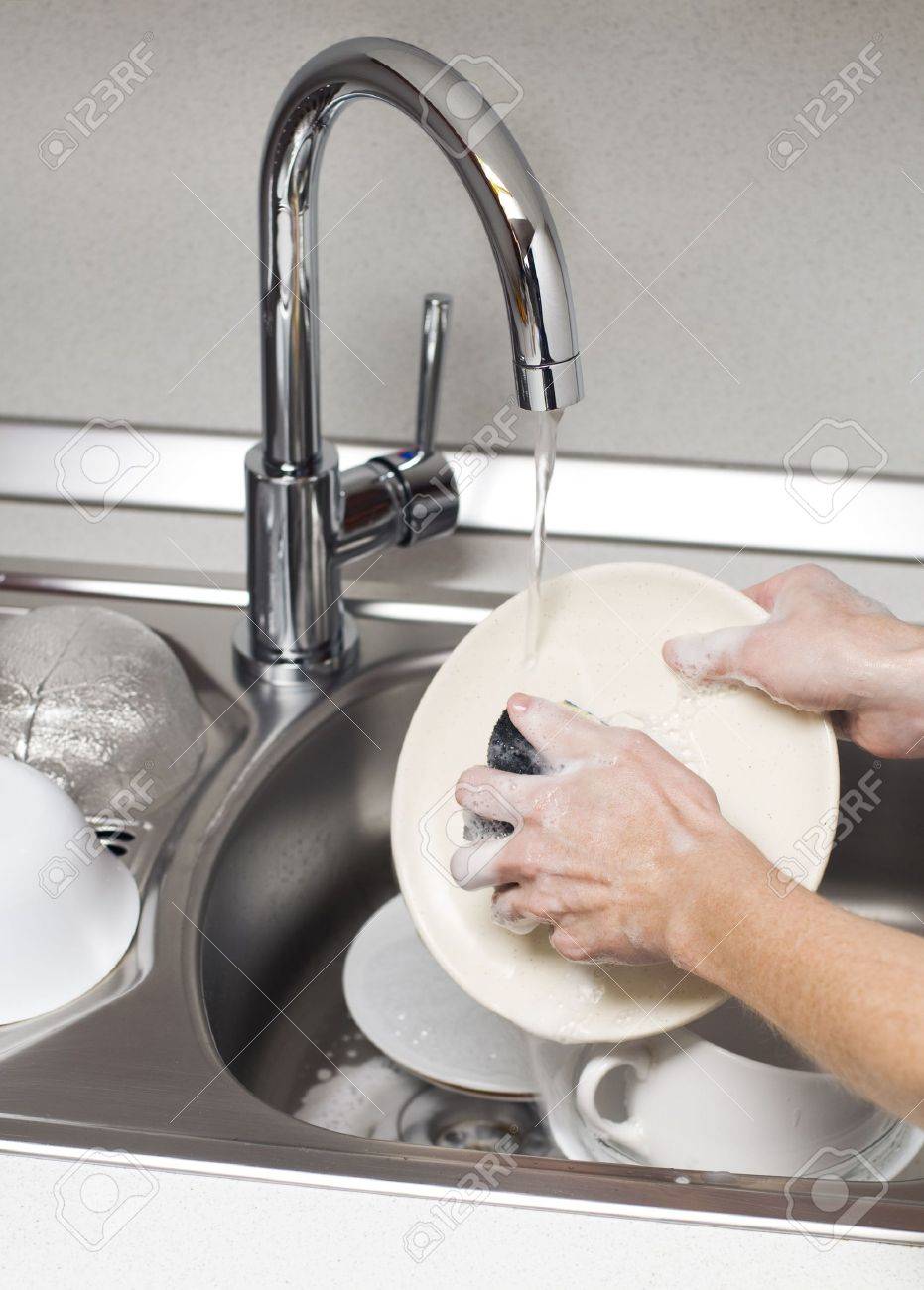 Kitchen Sink With Clean Dishes woman washing dishes in the kitchen close up stock photo, picture Kitchen Sink With Clean Dishes woman washing dishes in the kitchen close up stock photo, picture