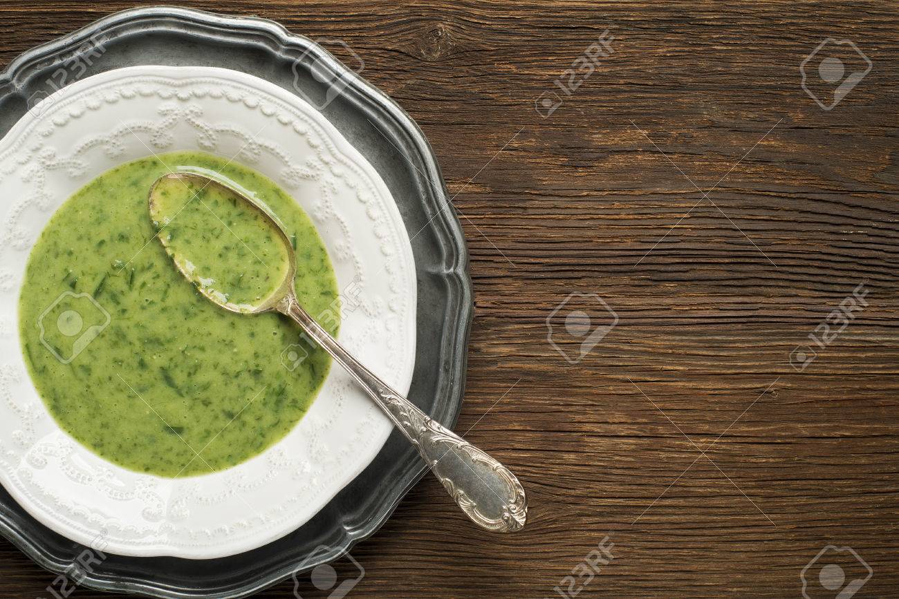 Fresh green soup on wooden background overhead shoot. - 56449652 Fresh green soup on wooden background overhead shoot. - 56449652