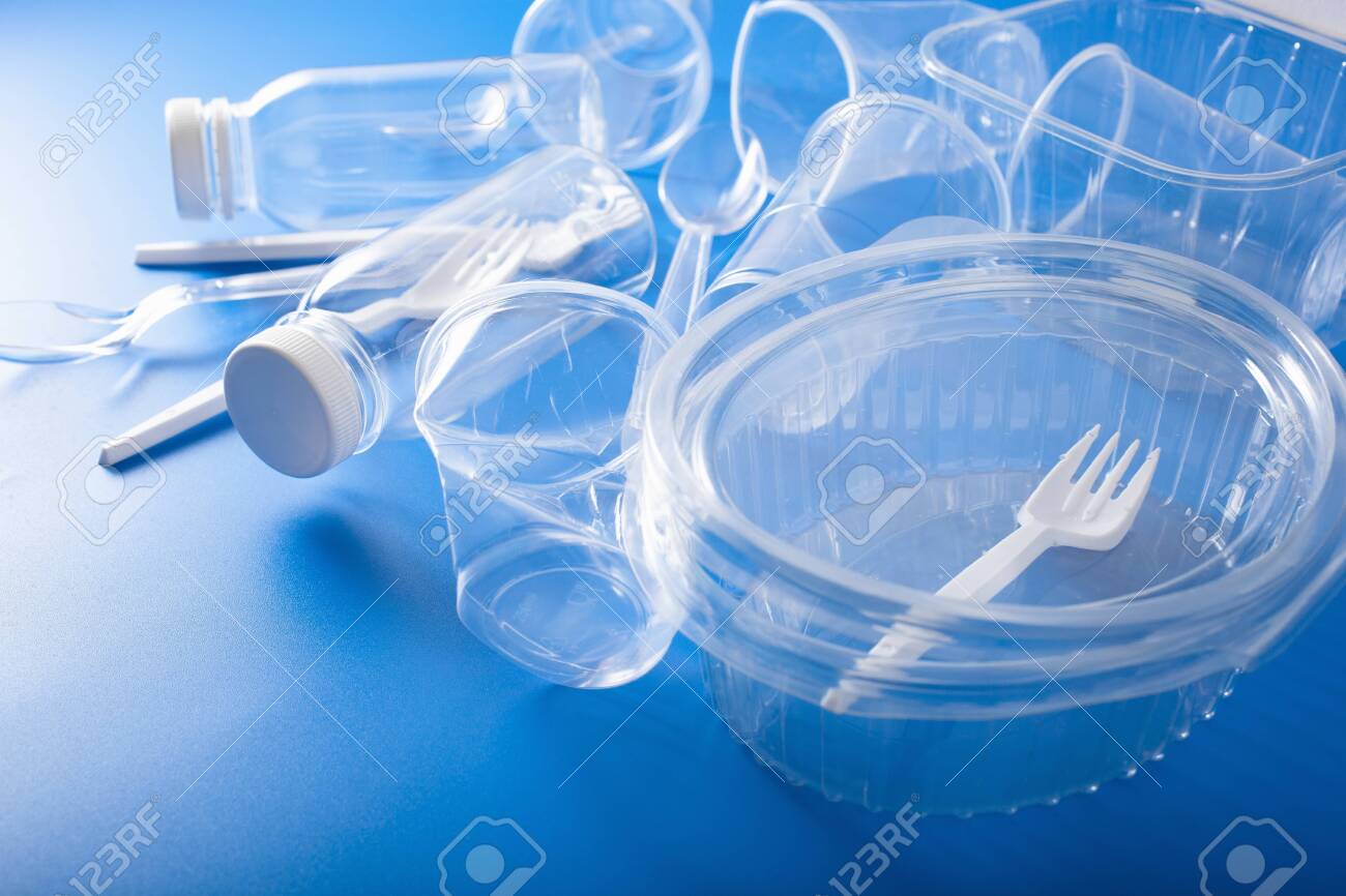 Single use plastic bottles, cups, forks, spoons. concept of recycling plastic, plastic waste - 125024259 Single use plastic bottles, cups, forks, spoons. concept of recycling plastic, plastic waste - 125024259