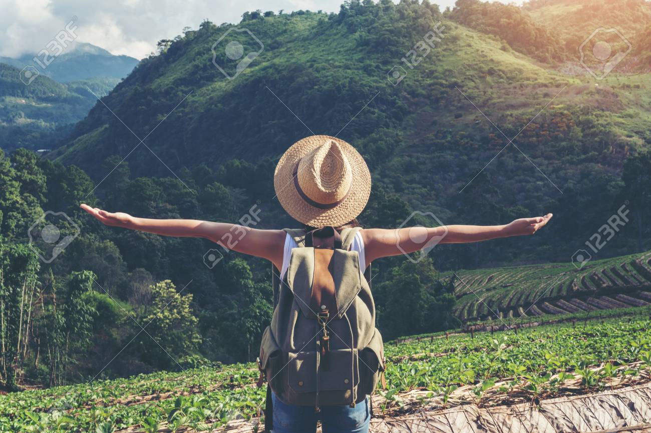 Happy female tourist to travel in wild trip hiking during vacation.Travel concept. - 88459136 Happy female tourist to travel in wild trip hiking during vacation.Travel concept. - 88459136