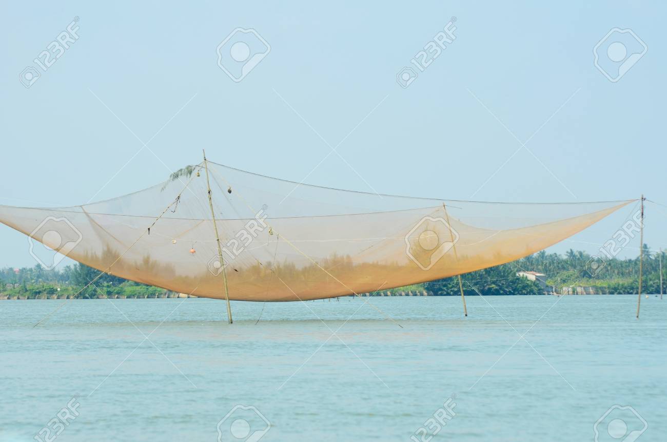 A Large Fishing Net Stretched Between Bamboo Poles Across Clear Stock Photo Picture And Royalty Free Image Image 116238502