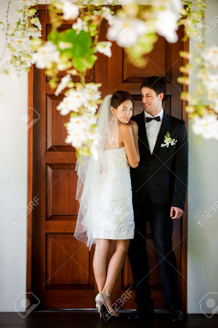 An attractive caucasian couple getting married outdoors - 6839359 An attractive caucasian couple getting married outdoors - 6839359