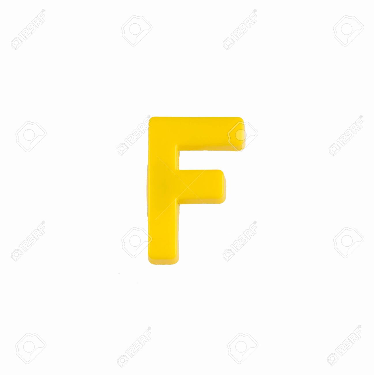 Letter F In Yellow Color - Plastic Part Stock Photo, Picture and Royalty  Free Image. Image 140204281.