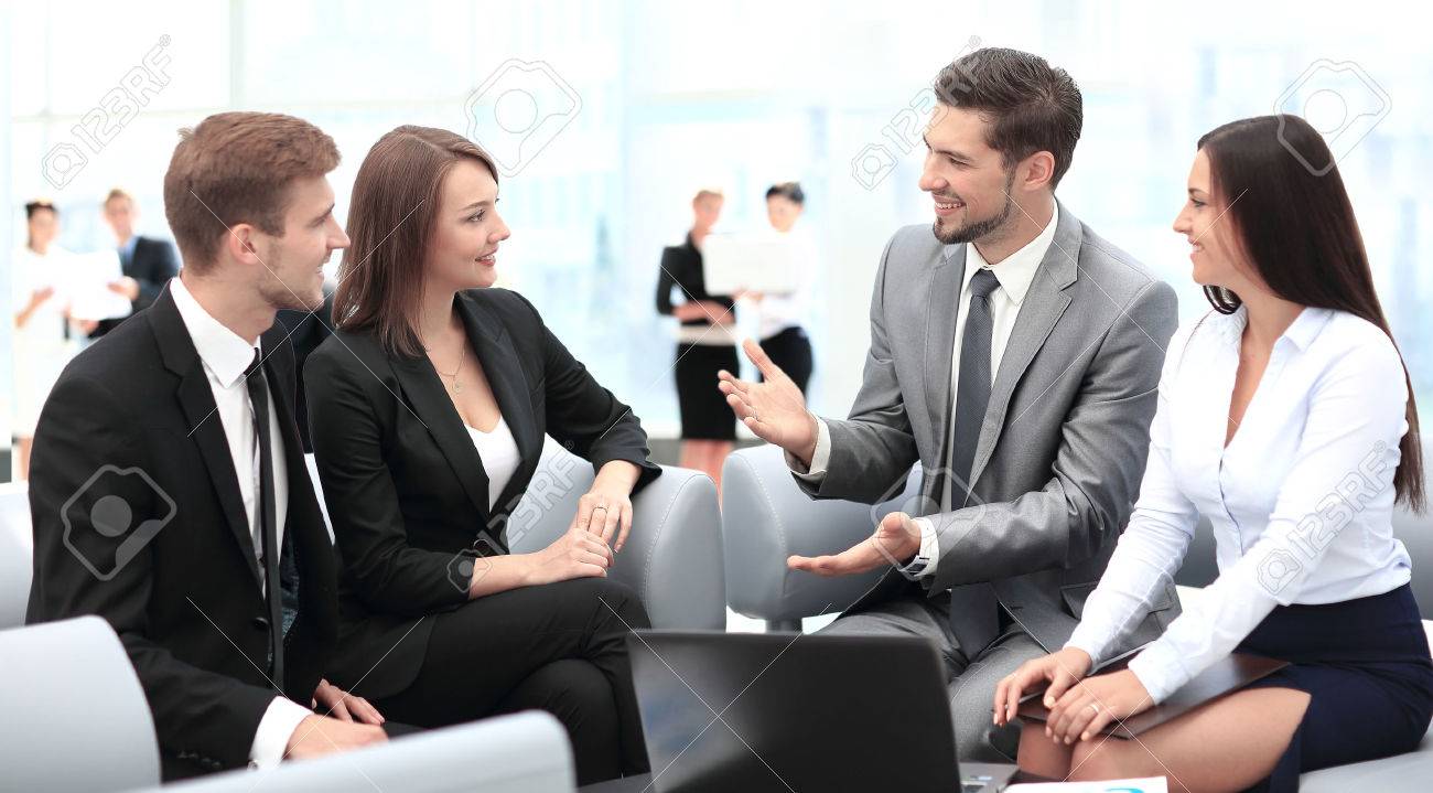 Happy business people talking on meeting at office - 67471849 Happy business people talking on meeting at office - 67471849