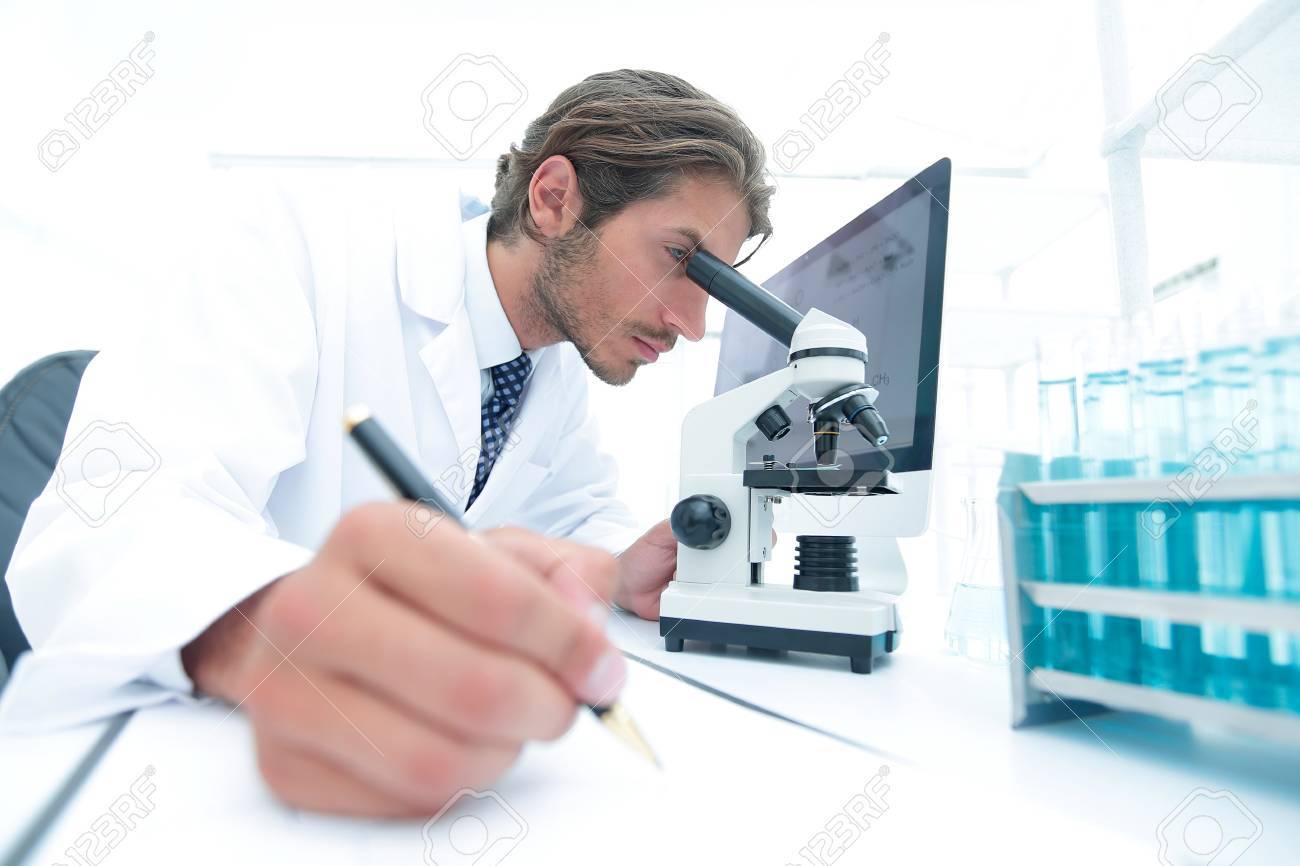 scientist makes a note of experiment in the laboratory - 88791171 scientist makes a note of experiment in the laboratory - 88791171