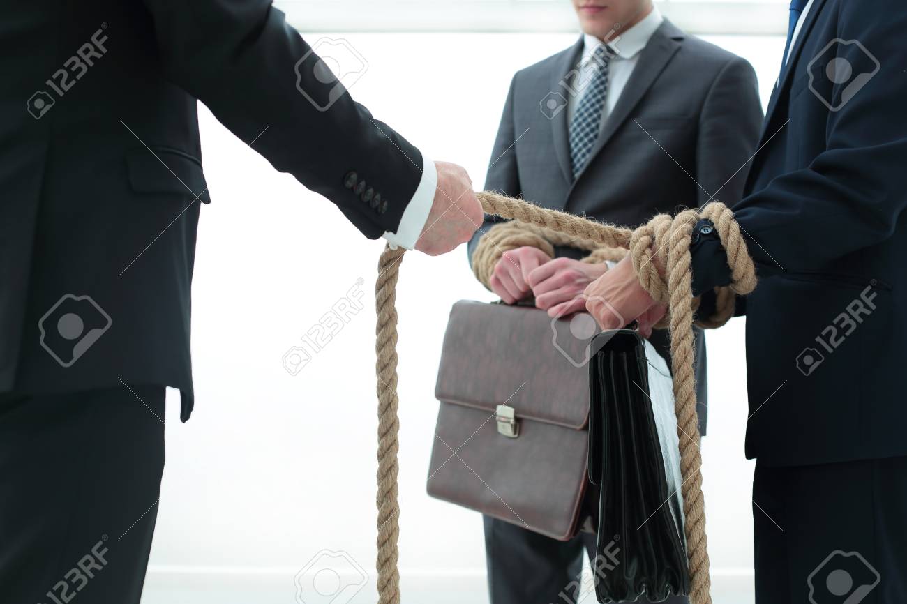close up.business leader pulls related employees - 102528523 close up.business leader pulls related employees - 102528523