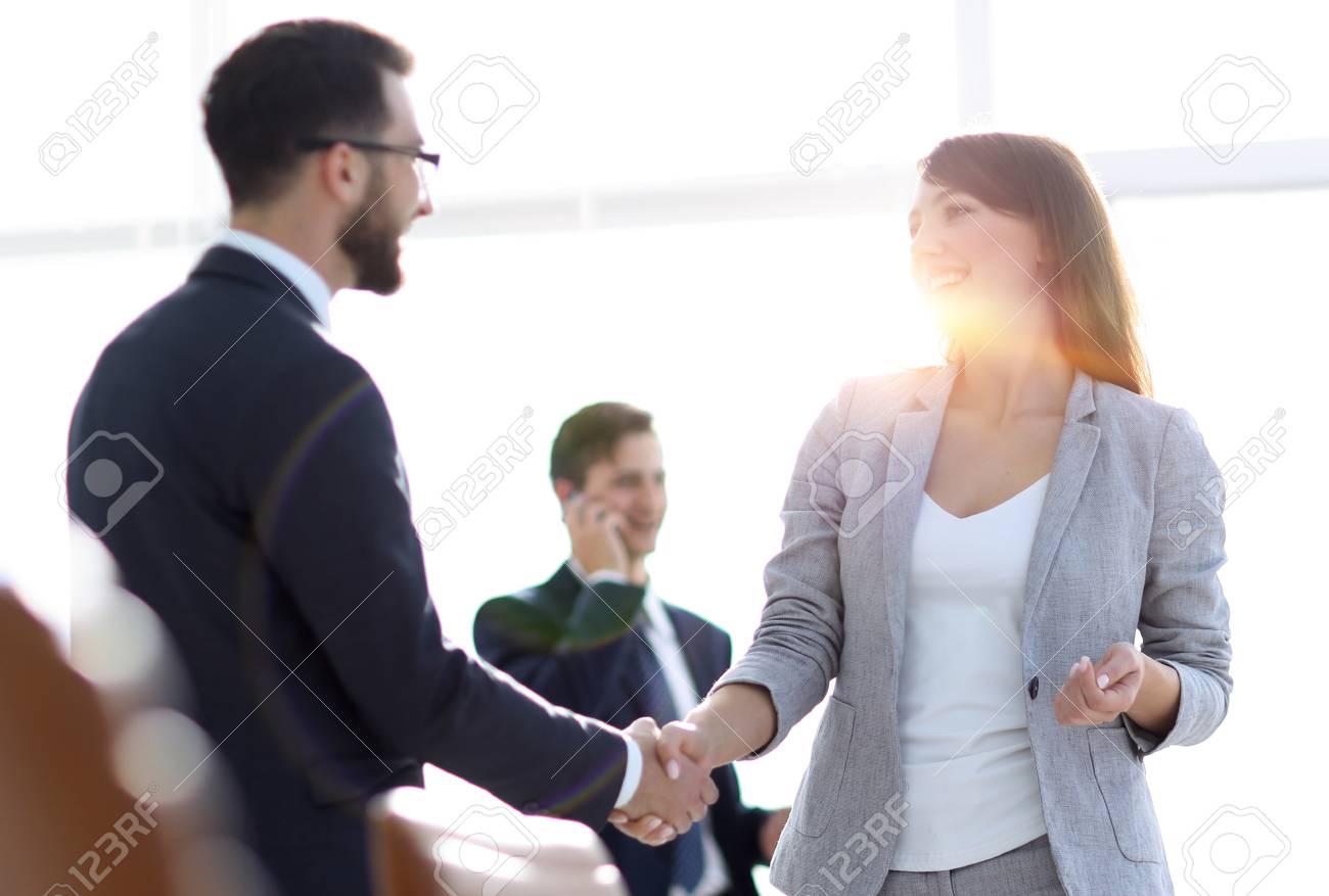 handshake between colleagues in the workplace - 107455767 handshake between colleagues in the workplace - 107455767