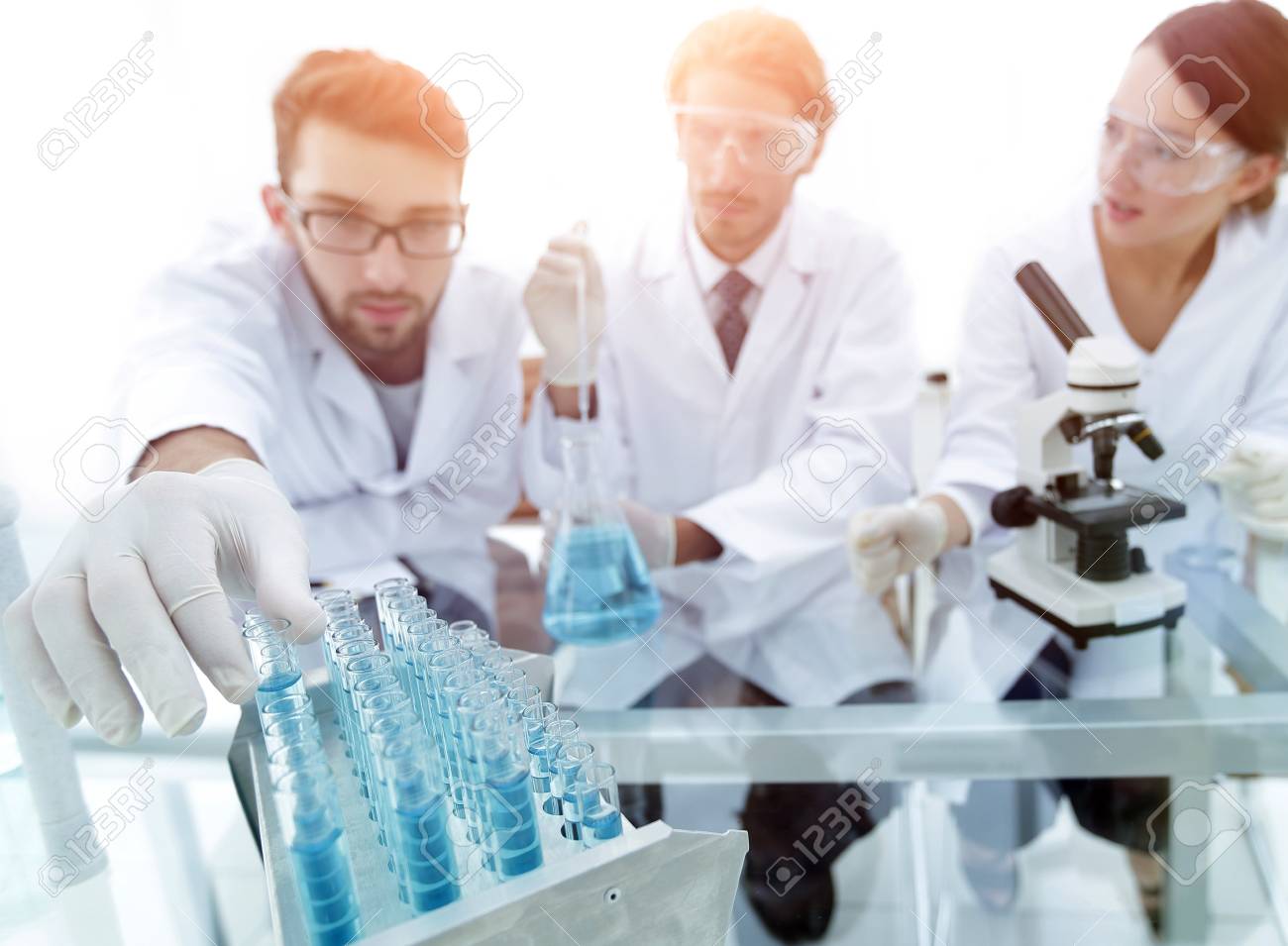 portrait of a group of researchers conducting research stock photo conducting research