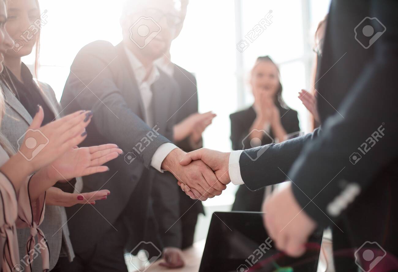 business partners shaking hands standing in the office. concept of partnership - 137869003 business partners shaking hands standing in the office. concept of partnership - 137869003