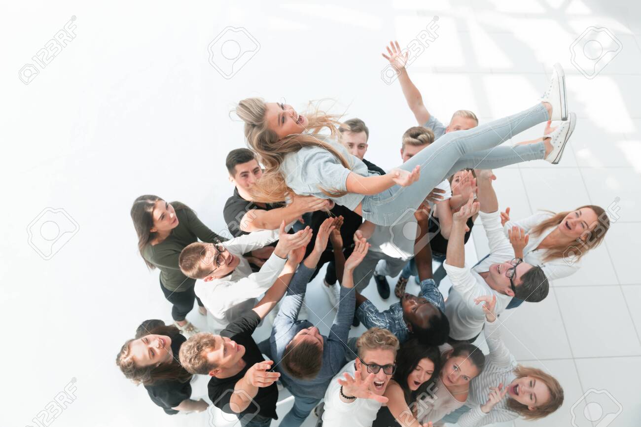 Happy Team Of Young People Rocking Their Leader Stock Photo Picture And Royalty Free Image Image 140823580 123rf com