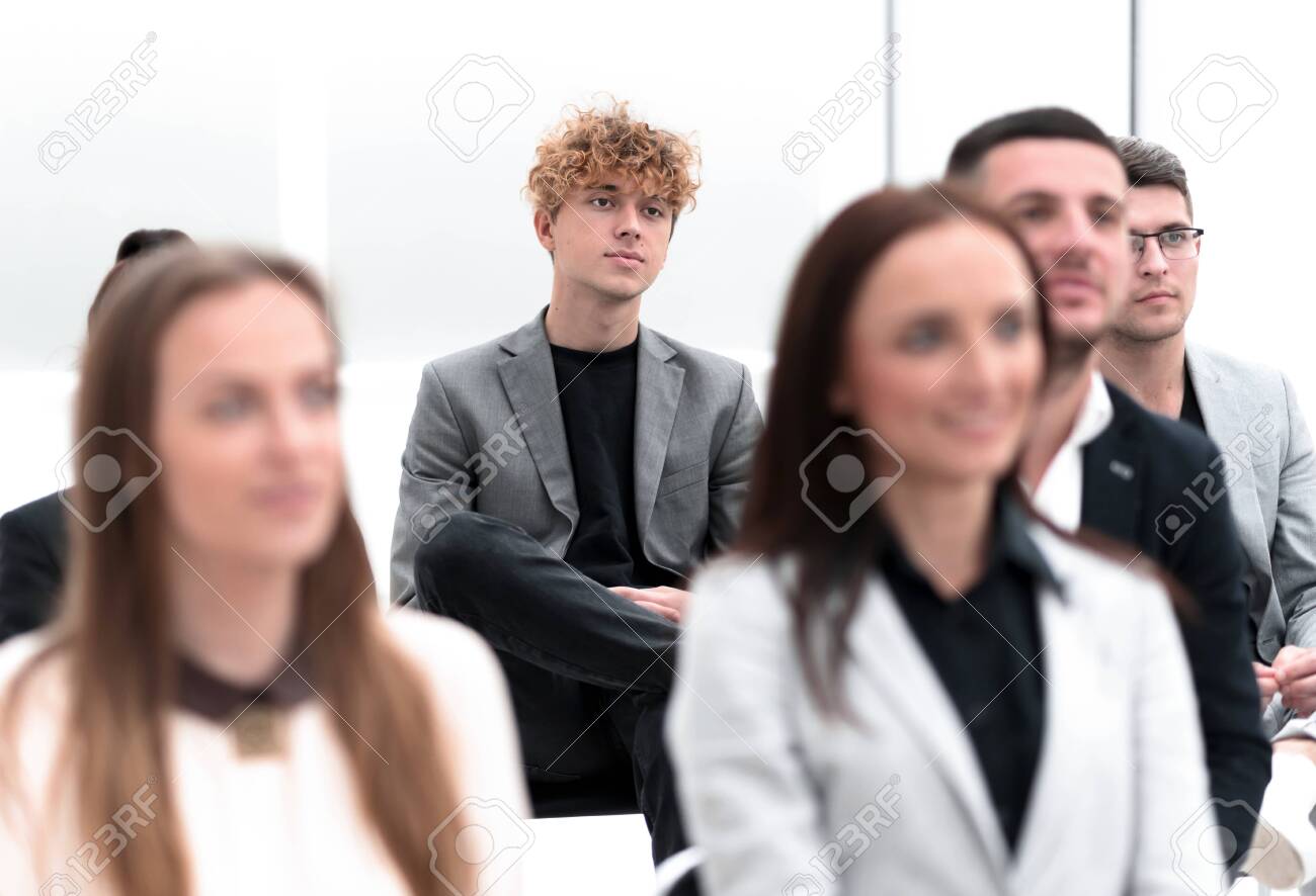 group of employees sitting in a conference room. - 149611702 group of employees sitting in a conference room. - 149611702