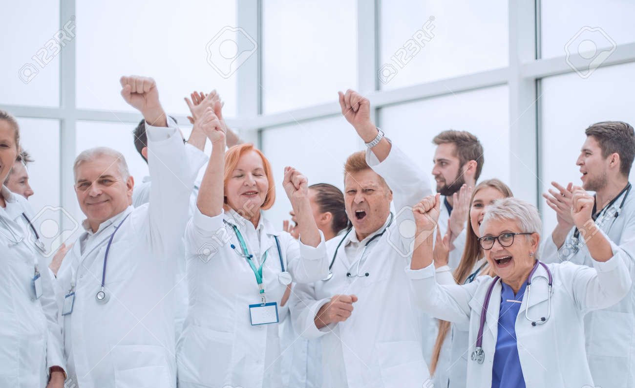 large group of diverse doctors celebrating together. - 165103534 large group of diverse doctors celebrating together. - 165103534