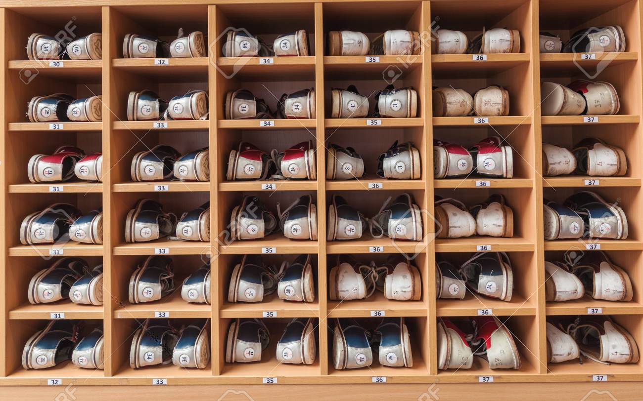 bowling shoes in a shoe cabinet sorted by size stock photo picture bowling shoes size