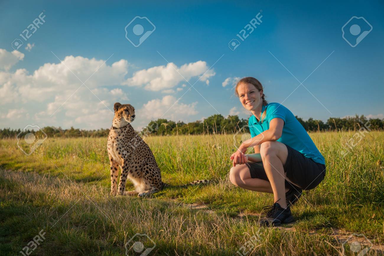 Young Woman On A Green Meadow In Summer Walking Cheetah Stock Photo Picture And Royalty Free Image Image 62487686