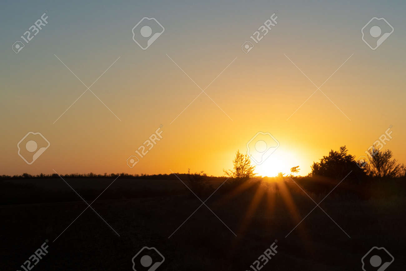 Natural sunset or sunrise over the field. Countryside - 155796825 Natural sunset or sunrise over the field. Countryside - 155796825