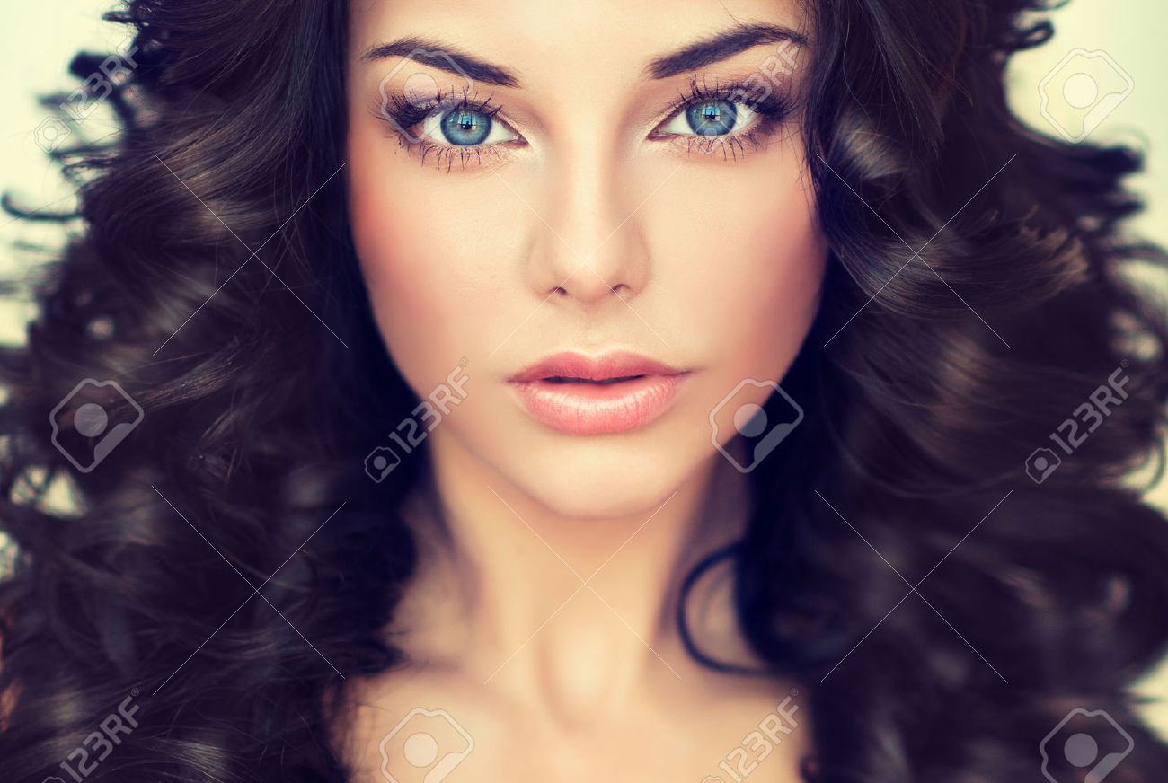 Beautiful girl model with long black curled hair - 46881760 Beautiful girl model with long black curled hair - 46881760