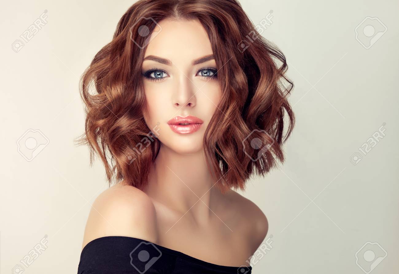Attractive brown haired woman with modern, trendy and elegant hairstyle. Example of middle length,dense and curly hair.Gentle make up and long eyelashes. - 89144166 Attractive brown haired woman with modern, trendy and elegant hairstyle. Example of middle length,dense and curly hair.Gentle make up and long eyelashes. - 89144166