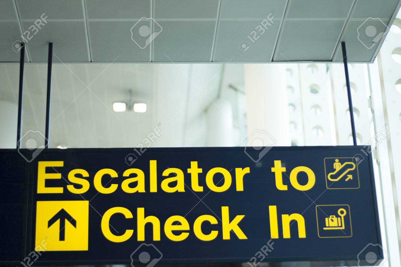 airport information sign light panel giving directions for checkin
