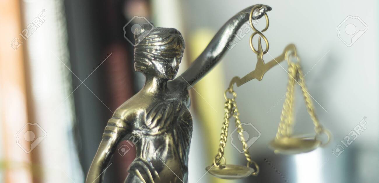 Legal law firm bronze statue of the goddess themis with scales of justice in attorneys office. - 122896887 Legal law firm bronze statue of the goddess themis with scales of justice in attorneys office. - 122896887