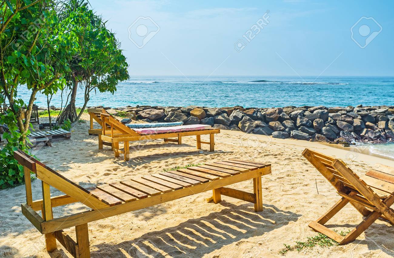 The Wooden Chaise Lounge And Folding Chairs In Garden Of Midigama - The Wooden Chaise Lounge And Folding Chairs In Garden Of Midigama