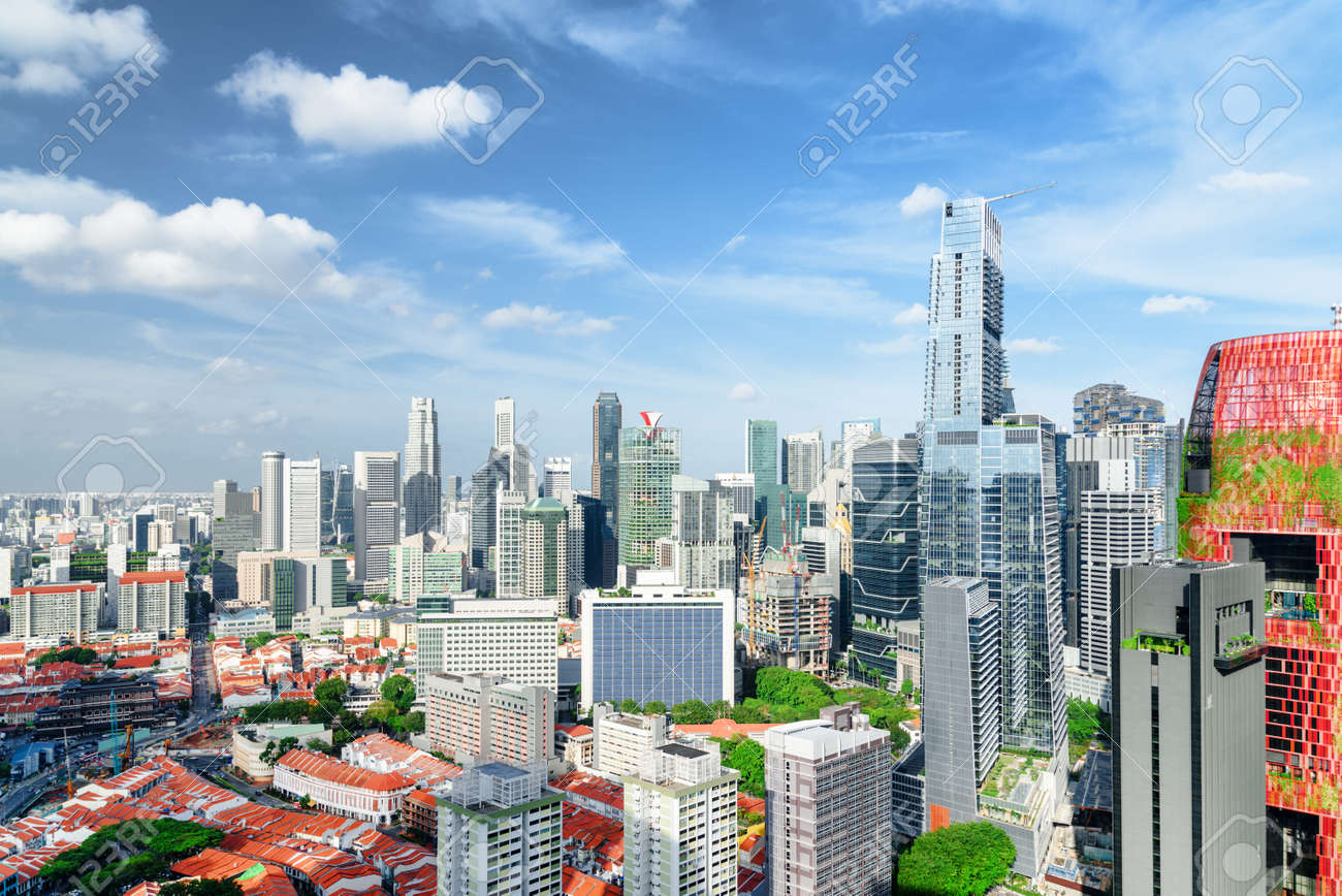 Scenic View Of Skyscrapers And Other Modern Buildings In Downtown Of  Singapore On Blue Sky Background. Amazing Sunny Summer Cityscape. Singapore  Is A Popular Tourist Destination Of Asia. 正版图像123RF中国- 高质量免版税图像库.