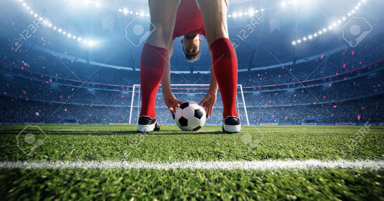 Football player in the stadium. An imaginary stadium is modeled and rendered - 165823013 Football player in the stadium. An imaginary stadium is modeled and rendered - 165823013
