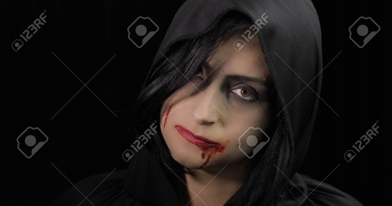 Vampire Halloween woman portrait. Beauty sexy Vampire girl with..