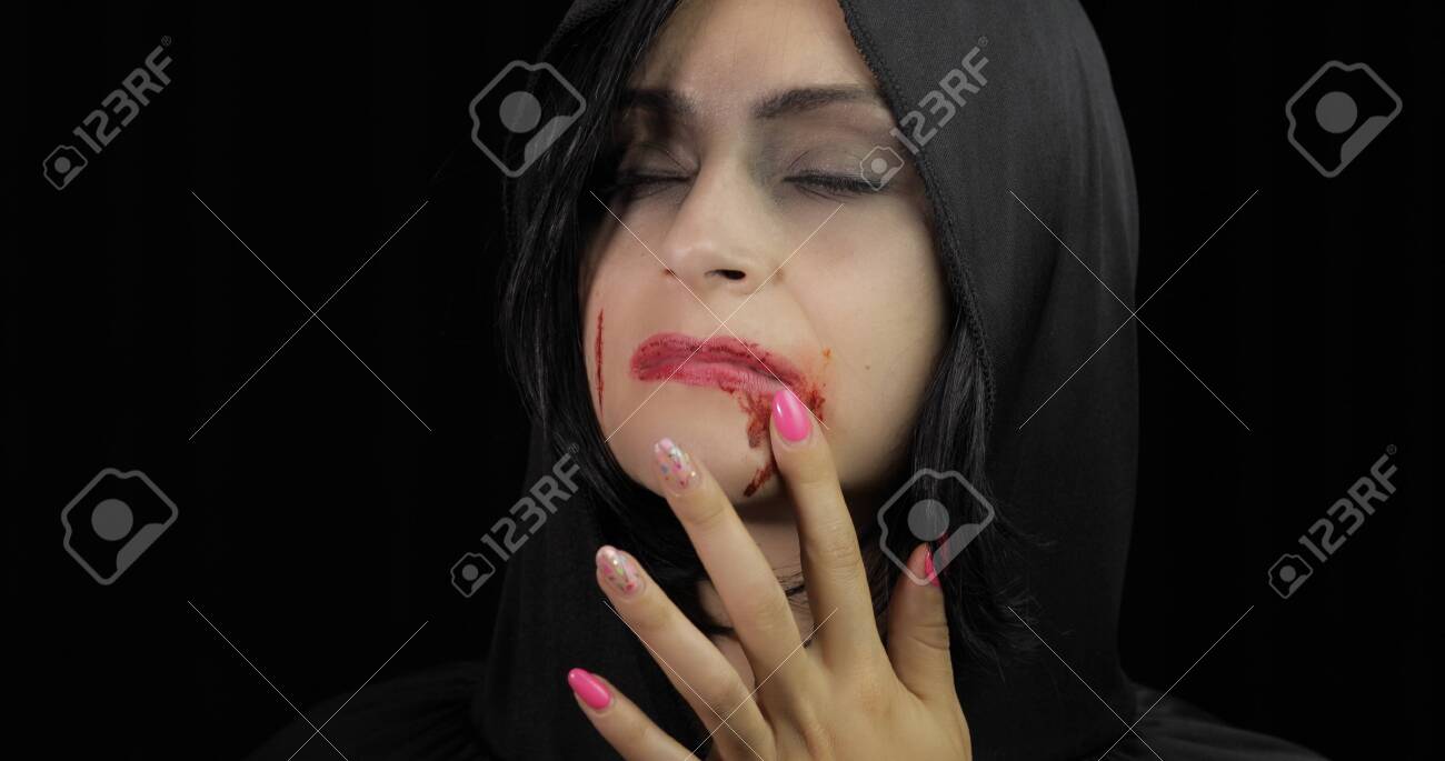 Vampire Halloween woman portrait. Beauty sexy Vampire girl with..