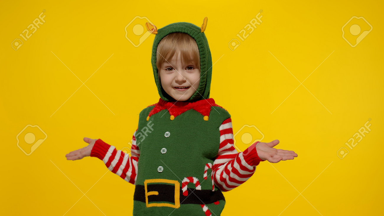 Download Side View Shocked Blonde Kid Girl In Christmas Elf Santa Helper Stock Photo Picture And Royalty Free Image Image 160581135