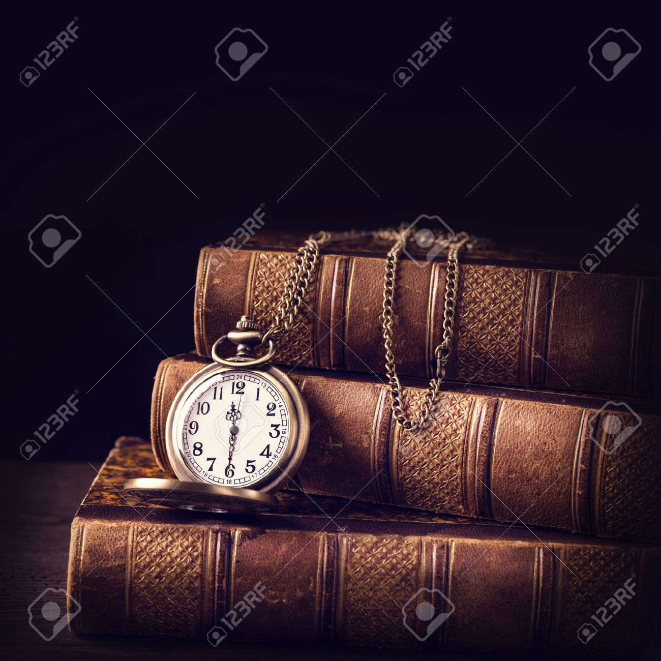old vintage books and a watch stock photo picture and royalty free