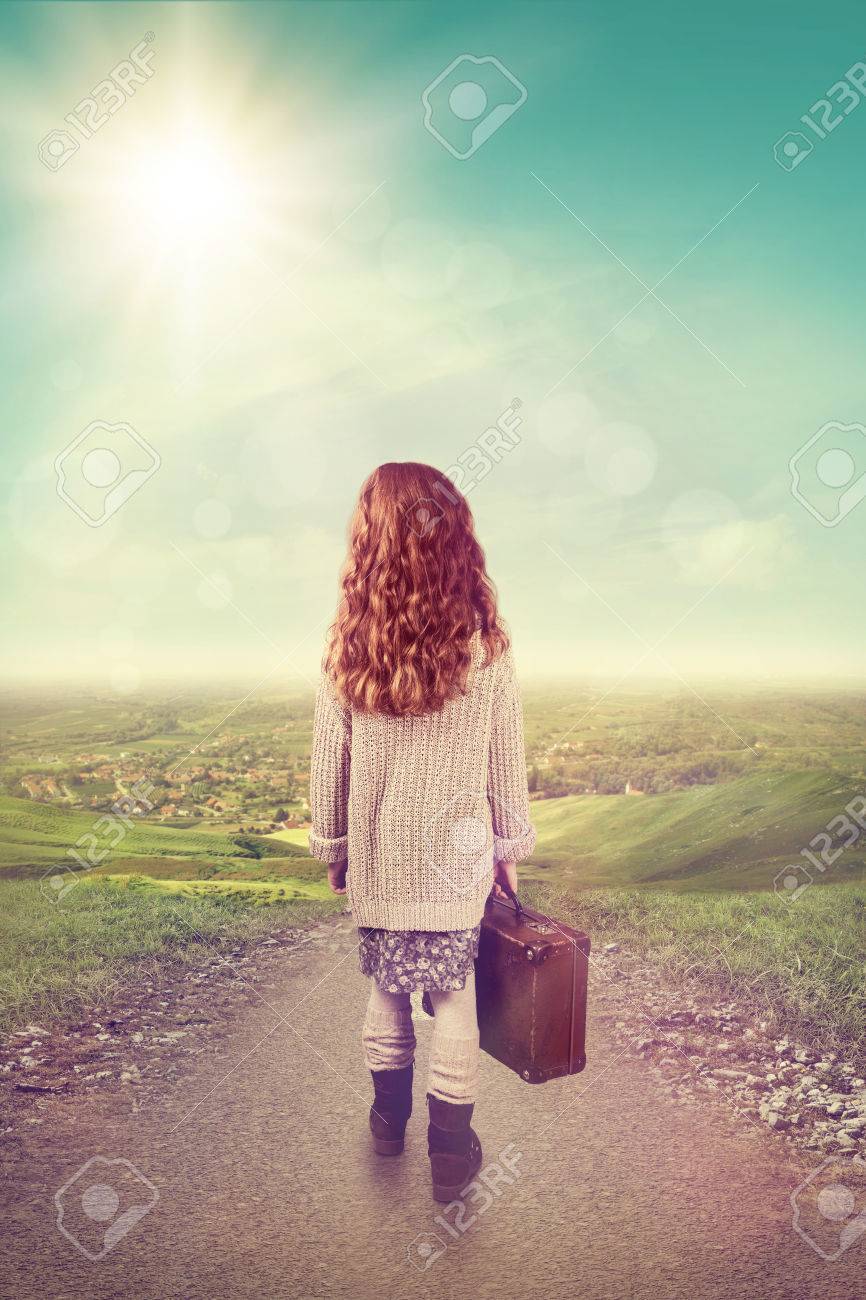 little girl with suitcase