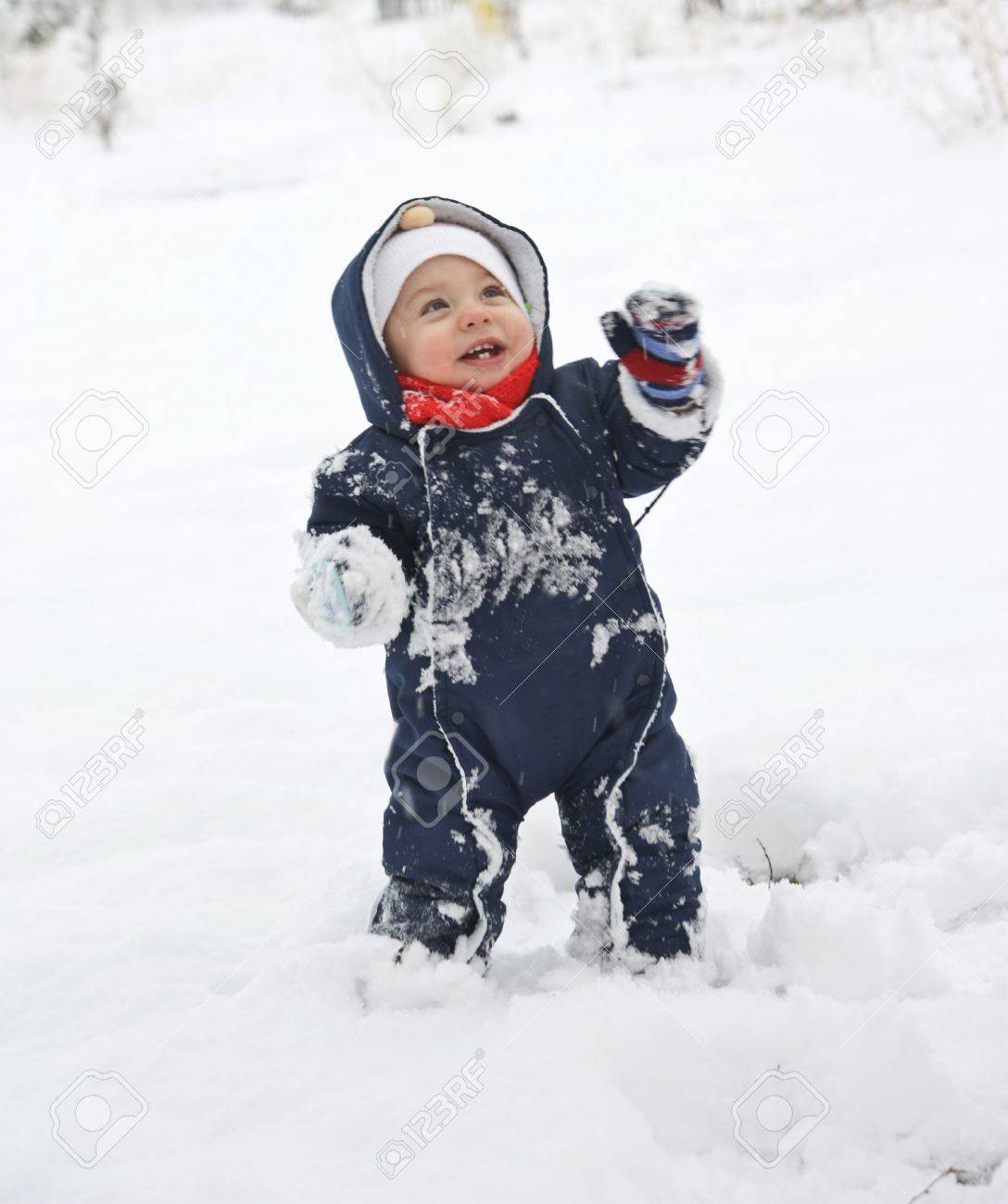 A Cute Baby In The Snow Stock Photo Picture And Royalty Free Image