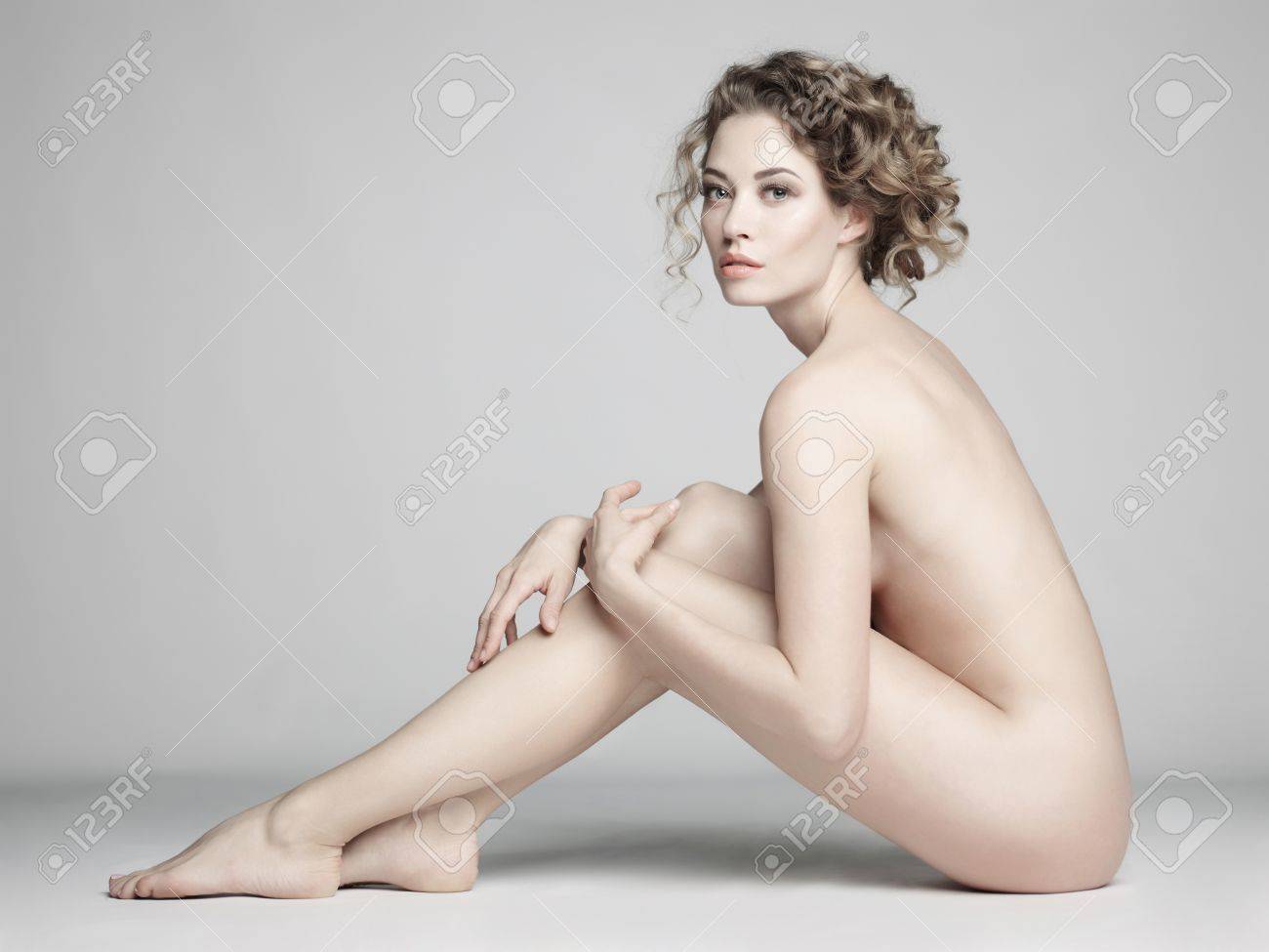 Nude Sexy Beautiful Woman With Long Stylish Hairstyle Pose On White  Background In Photostudio. Erotic Portrait