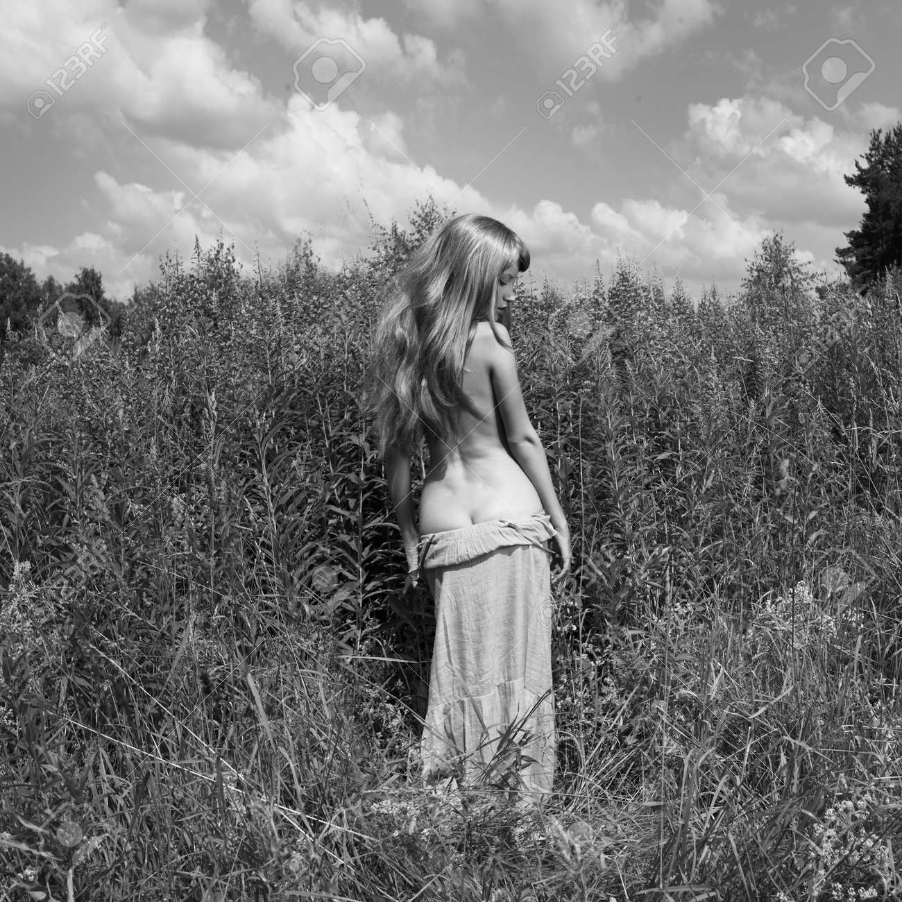 Nude Beautiful Woman Is Showing Her Naked Body Outside. Sexy Naturist Lady  Is Posing In The Fields Stock Photo, Picture and Royalty Free Image. Image  183740239.