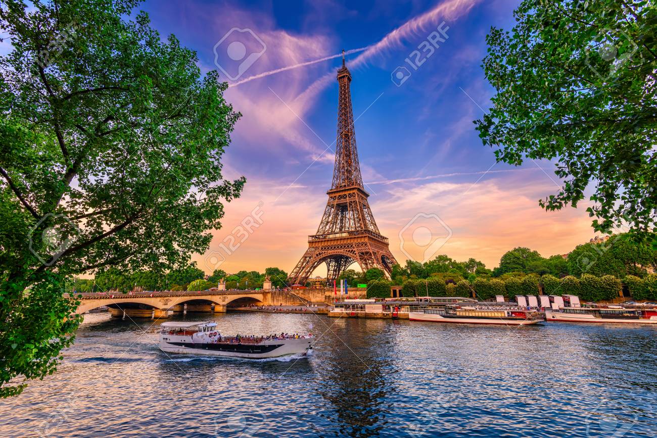 Paris Eiffel Tower and river Seine at sunset in Paris, France. Eiffel Tower is one of the most iconic landmarks of Paris. - 81220886 Paris Eiffel Tower and river Seine at sunset in Paris, France. Eiffel Tower is one of the most iconic landmarks of Paris. - 81220886
