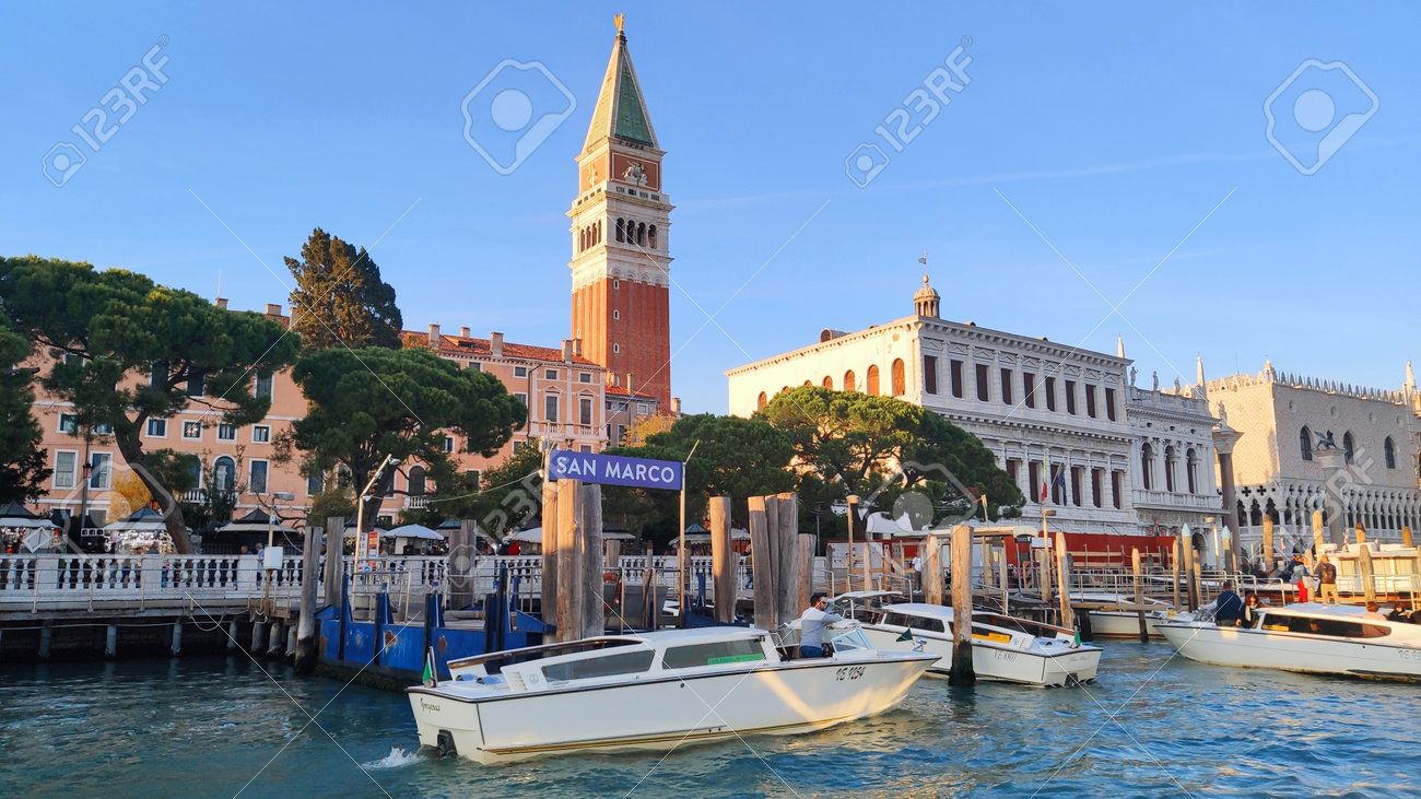 Venice Italy - October 10, 2019. Panorama of a beautiful view of the Grand Canal with houses with a boat in San Marco square. - 161601483 Venice Italy - October 10, 2019. Panorama of a beautiful view of the Grand Canal with houses with a boat in San Marco square. - 161601483