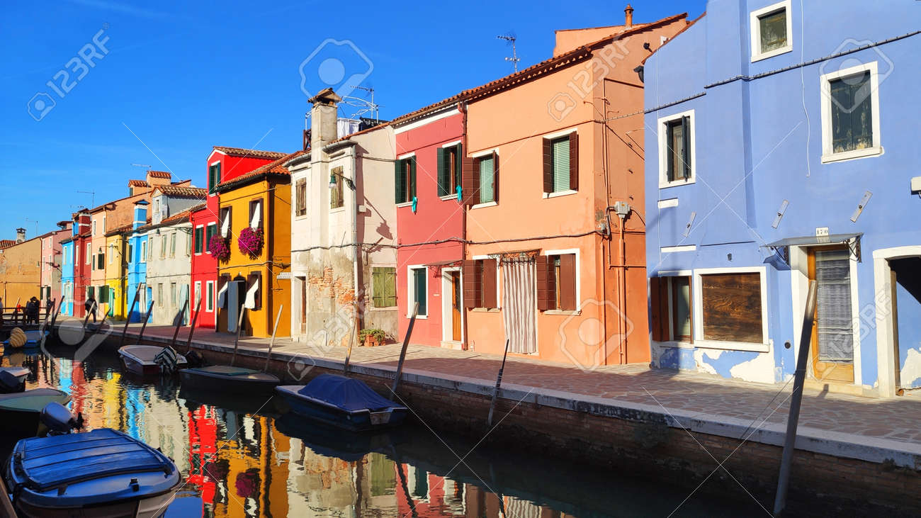 Venice Italy Burano . City view island with colorful houses in with boats - 164623025 Venice Italy Burano . City view island with colorful houses in with boats - 164623025