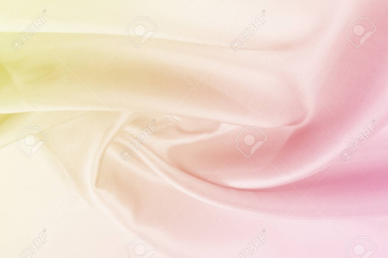 背景パターン テクスチャ 黄色のシルク生地ピンク パステル トーン ピンクと黄色の色のシルクの背景 の写真素材 画像素材 Image