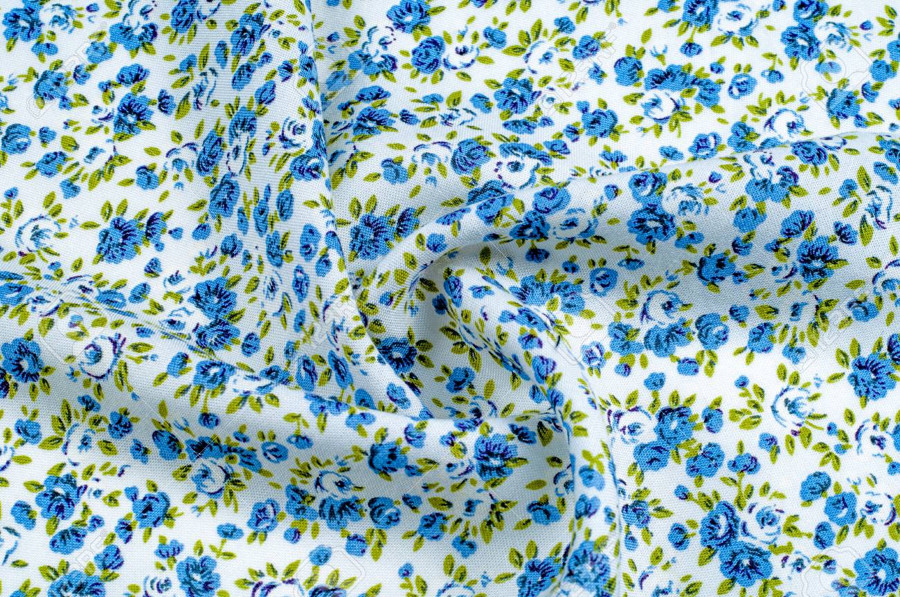 Background texture, pattern. thin cotton fabric with small blue..