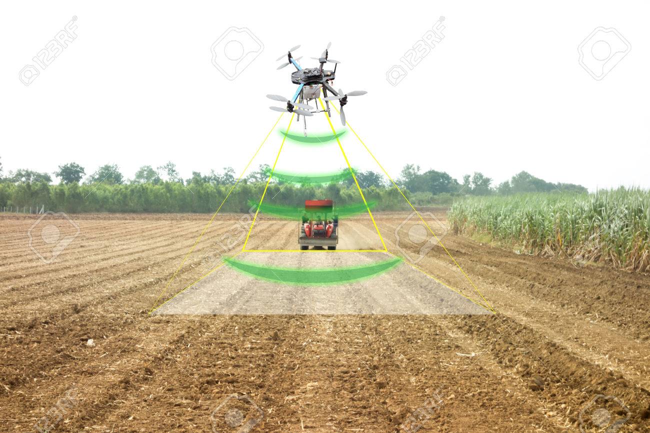 iot, internet of thins, agriculture concept, Farmer use drone to send a signal to detect and monitor the area while the tractor working in the farm with augmented reality technology - 83385105 iot, internet of thins, agriculture concept, Farmer use drone to send a signal to detect and monitor the area while the tractor working in the farm with augmented reality technology - 83385105