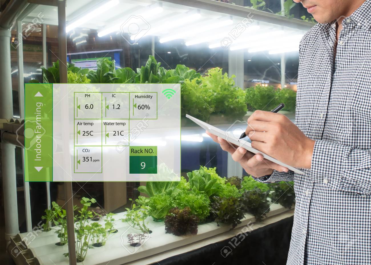 smart agriculture in futuristic concept, farmer use technology to monitor, control and adjustment led, atmosphere,humidity, water level and keep tracking harvesting time in vertical or indoor farming - 87117741 smart agriculture in futuristic concept, farmer use technology to monitor, control and adjustment led, atmosphere,humidity, water level and keep tracking harvesting time in vertical or indoor farming - 87117741