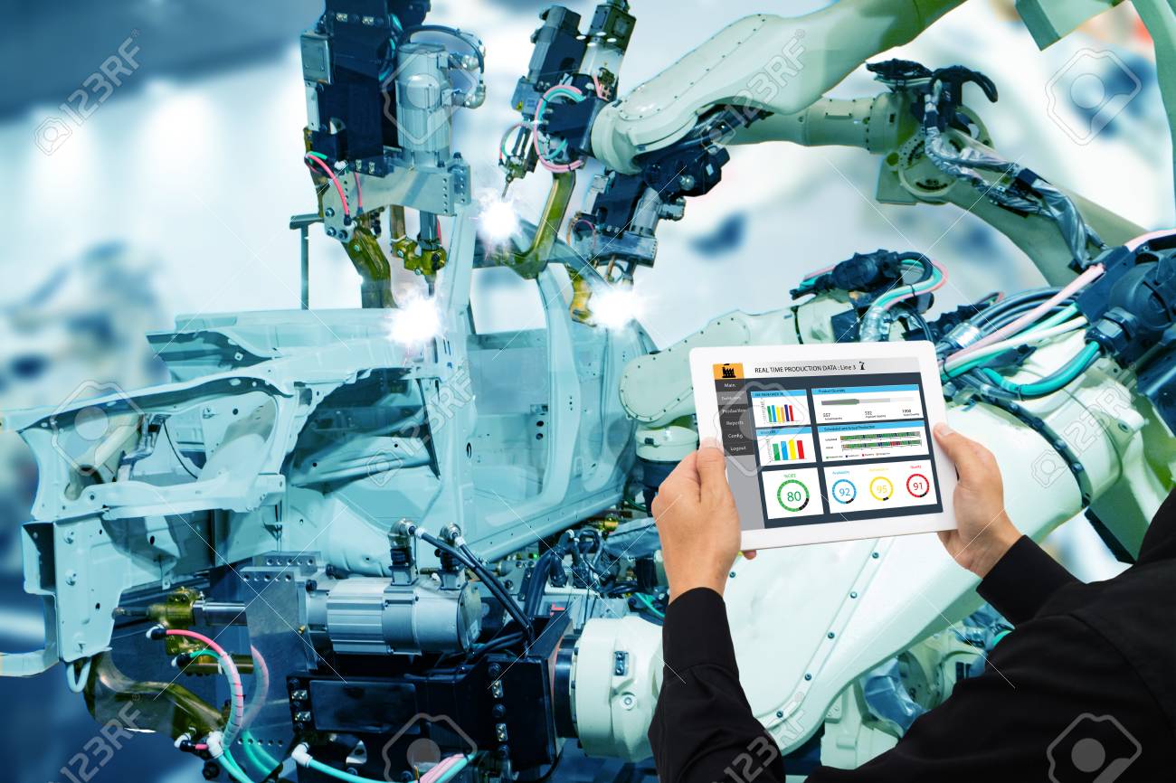 iot industry 4.0 concept,industrial engineer using software (augmented, virtual reality) in tablet to monitoring machine in real time.Smart factory use Automation robot arm in automotive manufacturing - 93708182 iot industry 4.0 concept,industrial engineer using software (augmented, virtual reality) in tablet to monitoring machine in real time.Smart factory use Automation robot arm in automotive manufacturing - 93708182