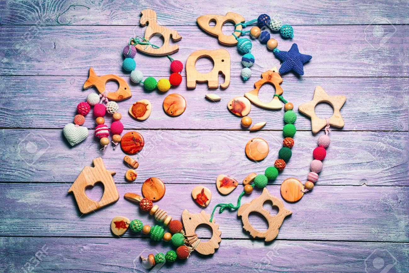 wooden toys for toddlers laid out in a circle with a free space