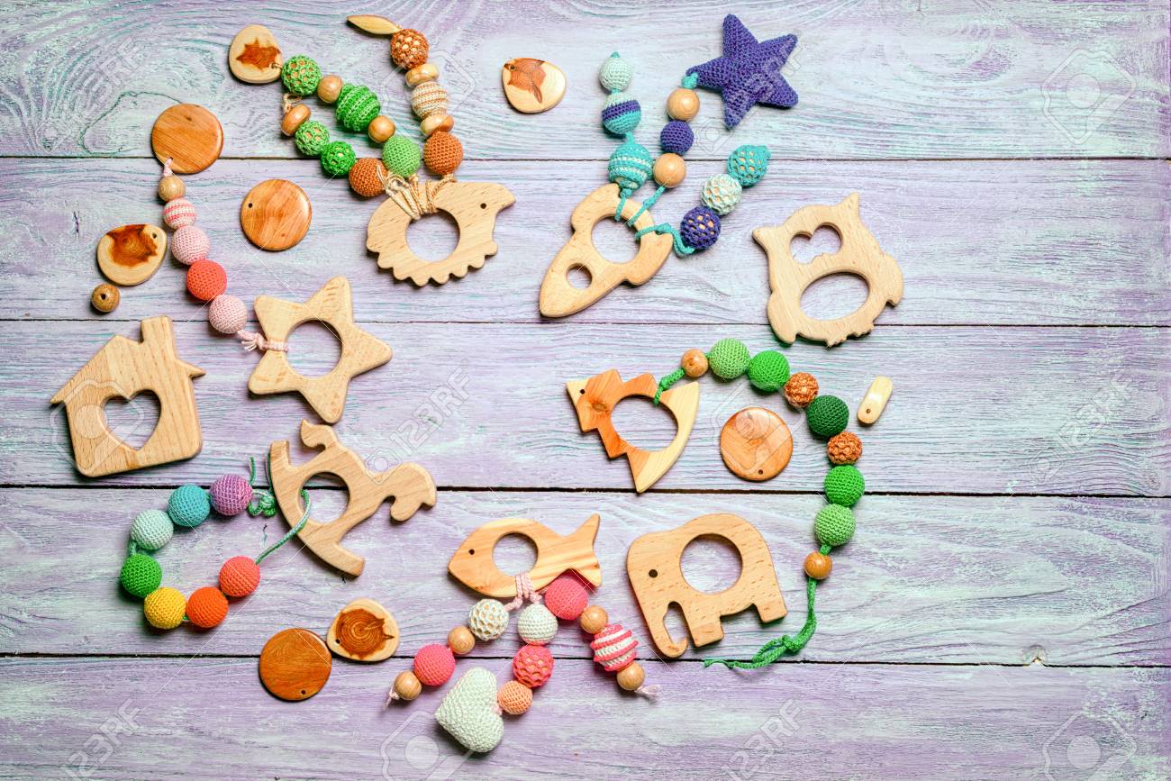 wooden toys for toddlers laid out in a circle with a free space