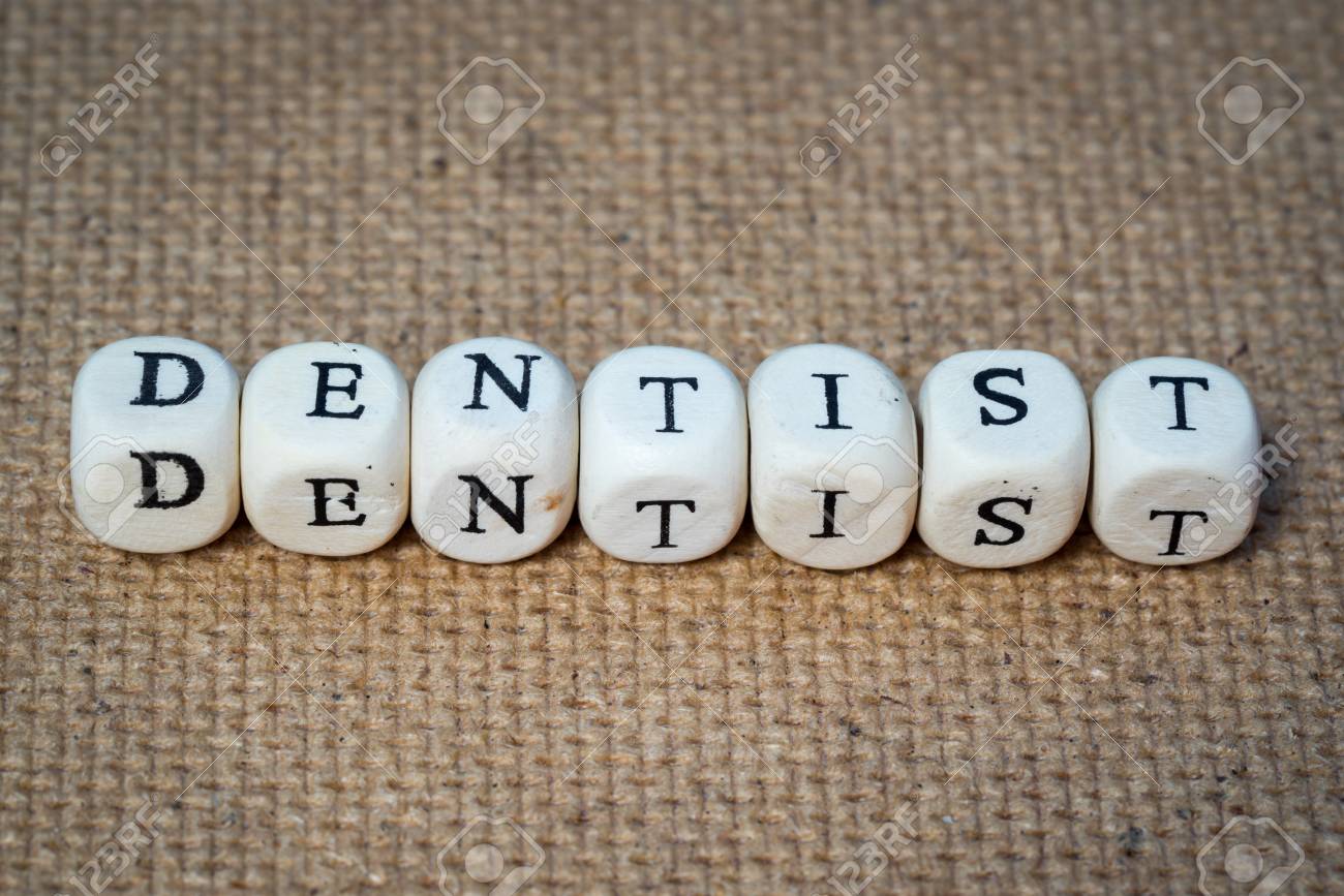 dentist word made from toy cubes with letters stock photo picture