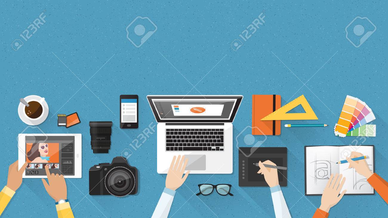 Creative team working together at office desk, teamwork and advertising concept - 55804400 Creative team working together at office desk, teamwork and advertising concept - 55804400